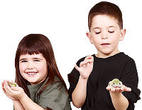 Children holding frogs. Photo copyrighted.