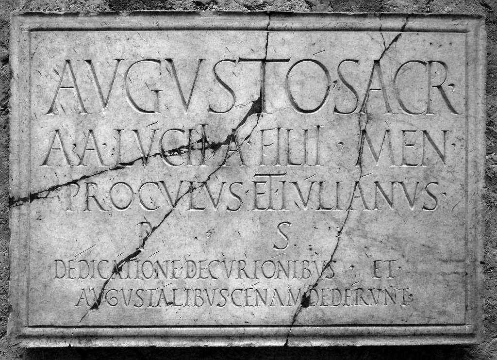 Classical Latin on 1st century plaque in Herculaneum, Italy. Photographer: Oleg Kr. Copyrighted. Licensed (flickr: 3215597073)