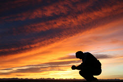 Man praying. Photograph copyrighted. Licensed.