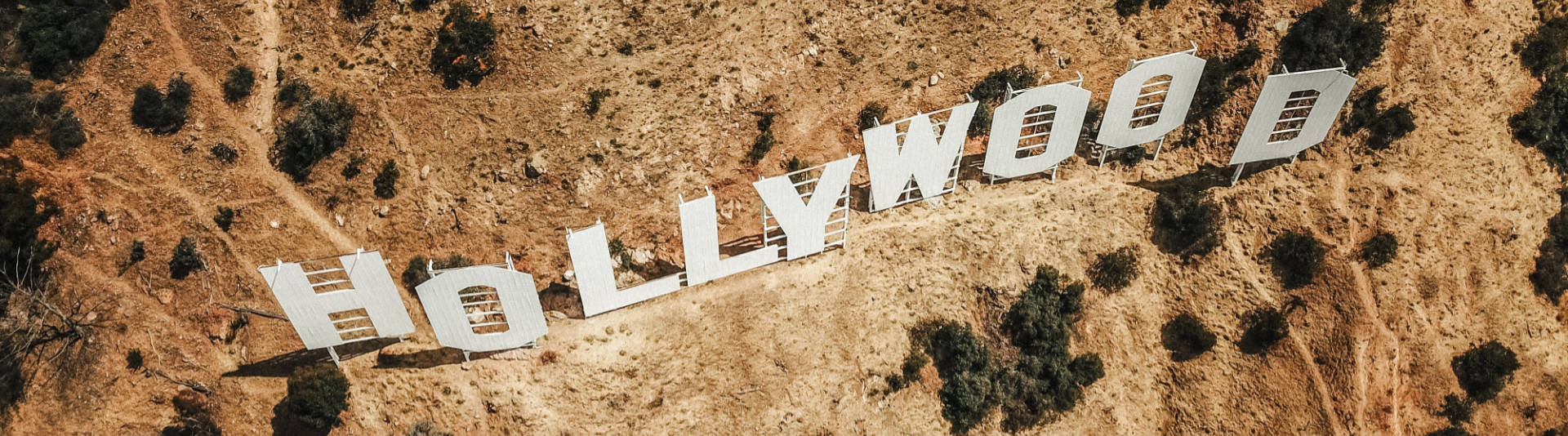 Photograph of Hollywood sign. Copyrighted. Photographer: Justin Aikin. Licensed (dz-j_dxVSCE)
