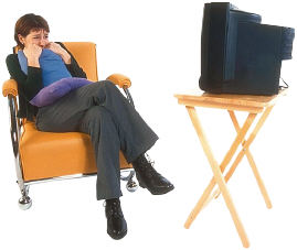 Woman watching her TV. Copyrighted photograph.