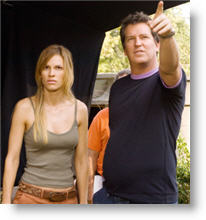Hilary Swank with director Stephen Hopkins on the set of THE REAPING. Copyright, Warner Bros.